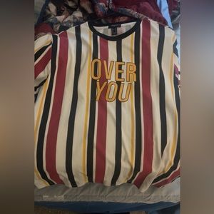 Size medium from forever 21. Oversized which means it hangs lower than regular